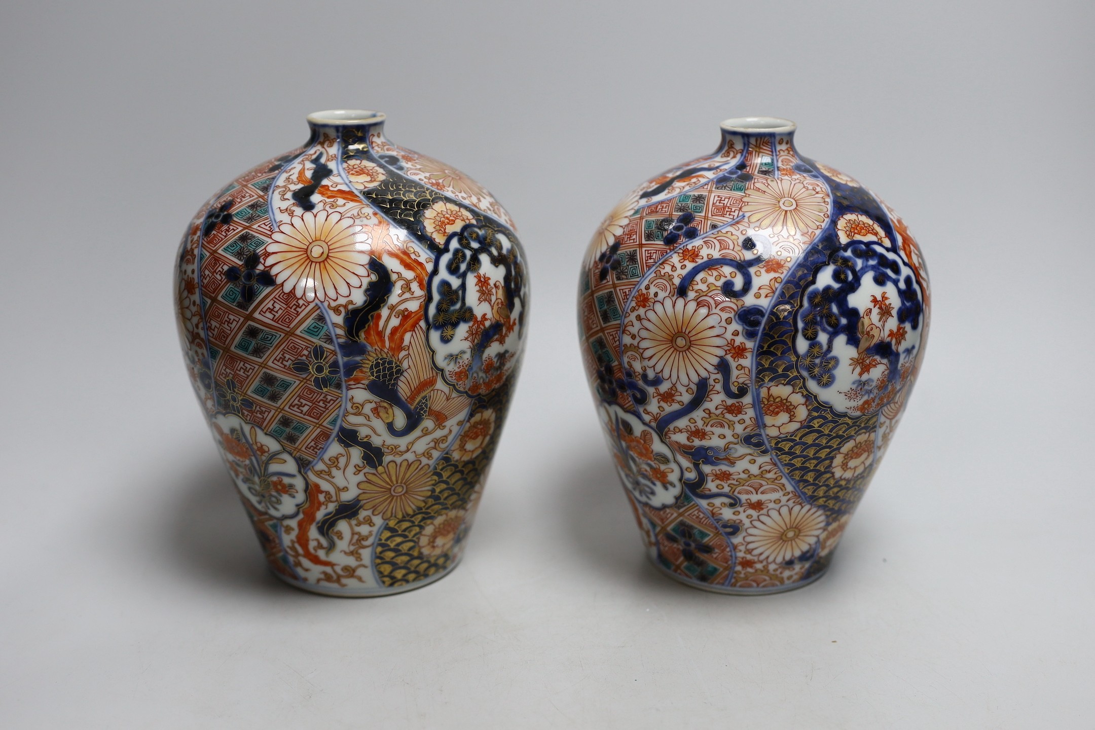 A pair of Japanese Fukugawa Imari bottle vases, signed. 19cm tall